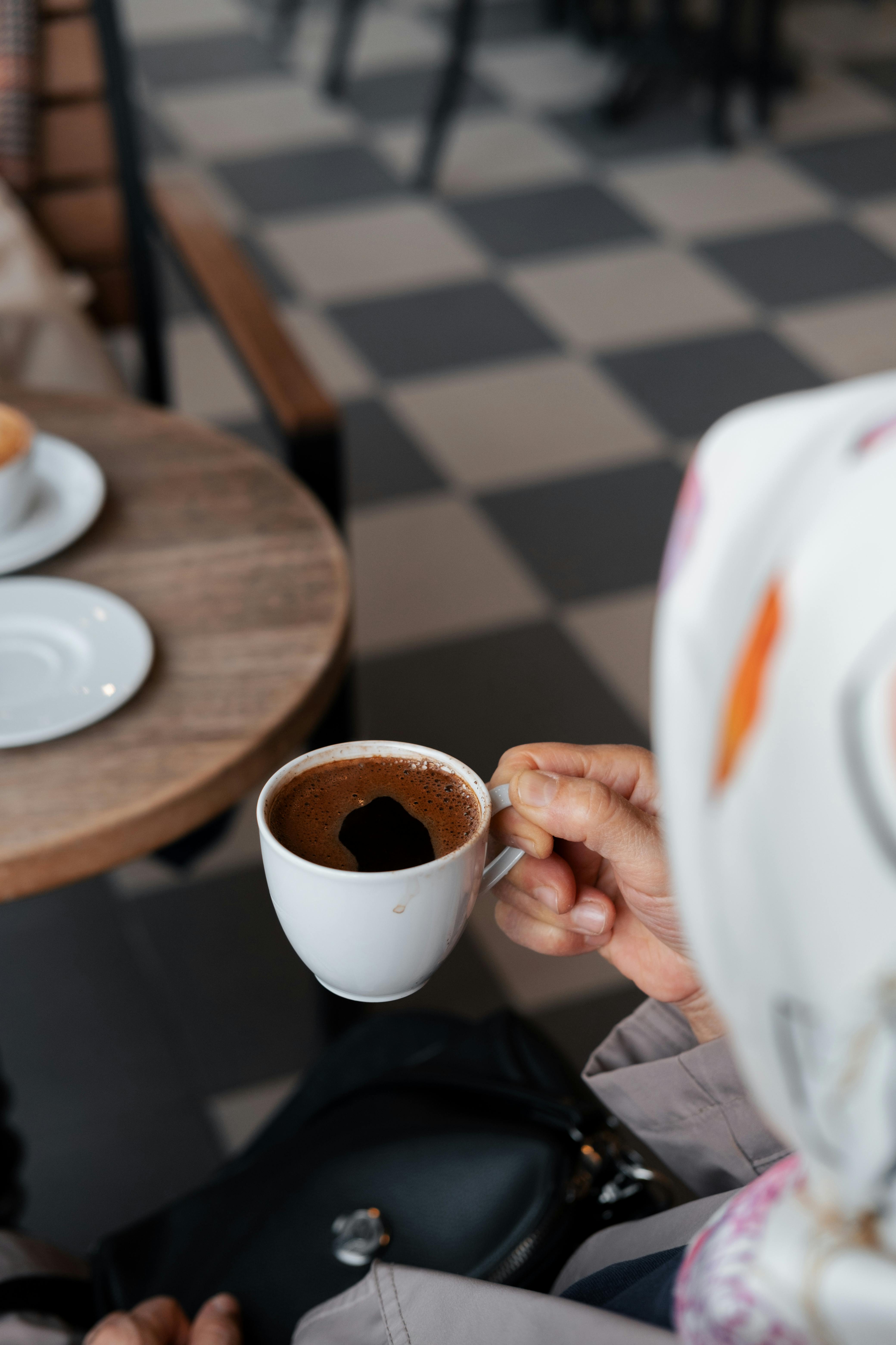 Hand Holding Coffee Cup · Free Stock Photo