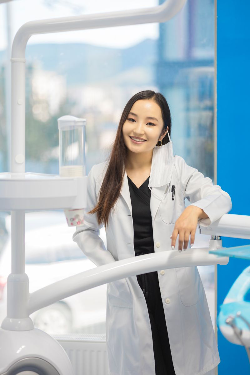 Asian female dentist smiling in dental clinic — Tyla AI demo