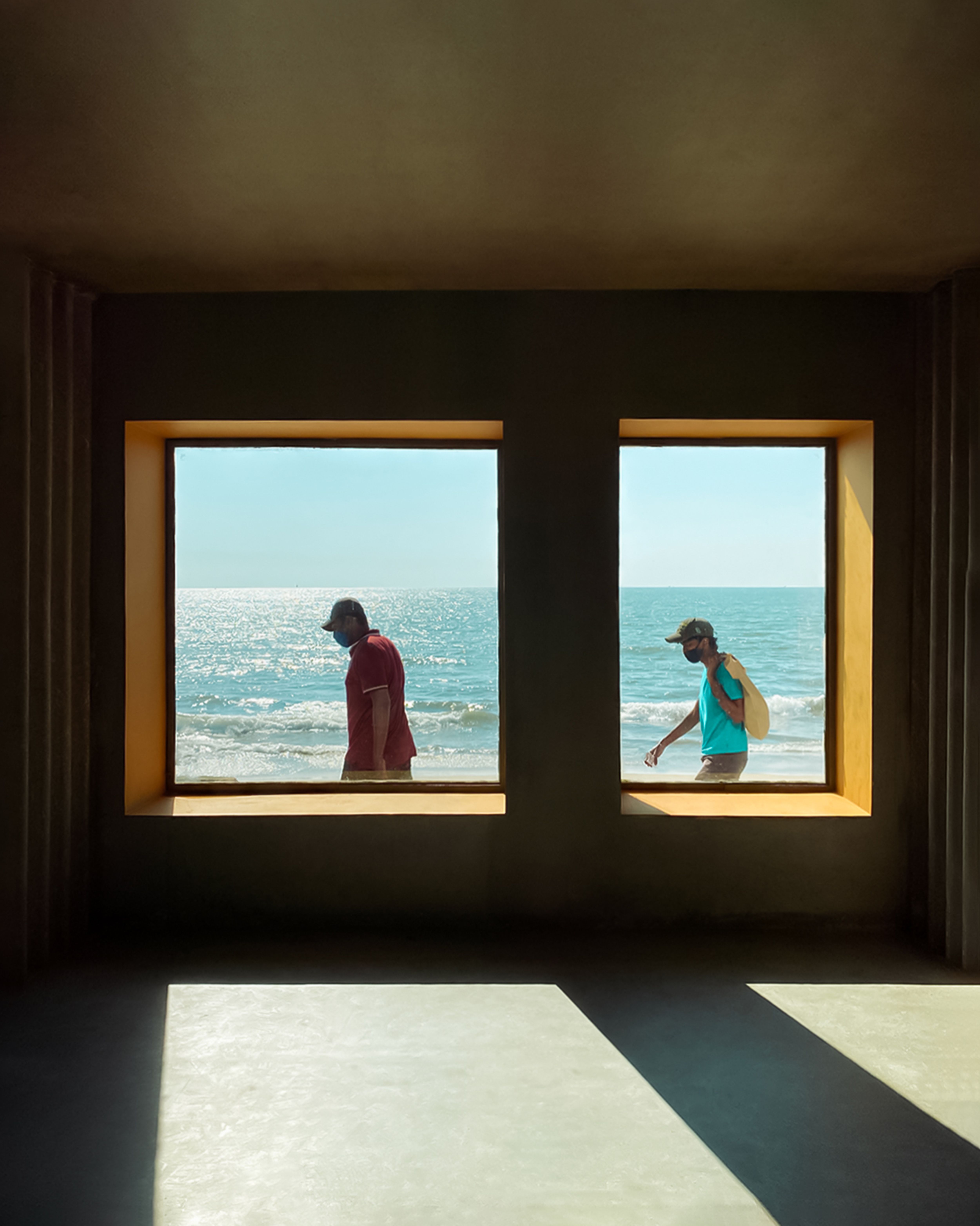 Men Walking behind Empty Room Windows · Free Stock Photo