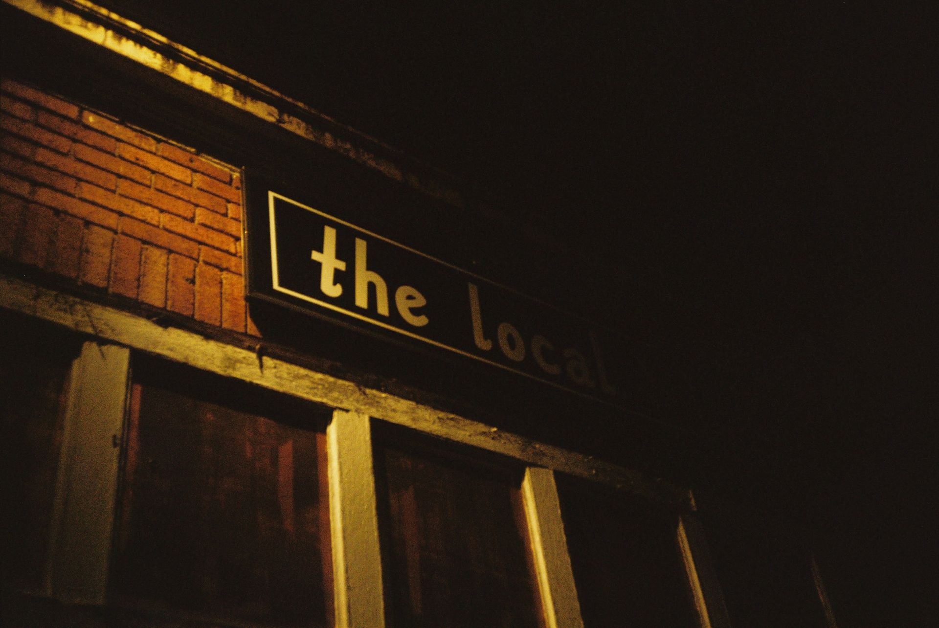 Sign Above the Windows of The Local Tap House of Nyack at Night