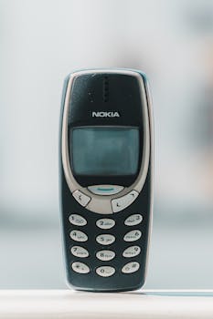 Retro Nokia 3310 cell phone shown in a classic front view, capturing its vintage charm.