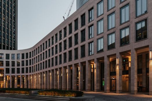 Contemporary office building exterior with glass facade and architectural design.
