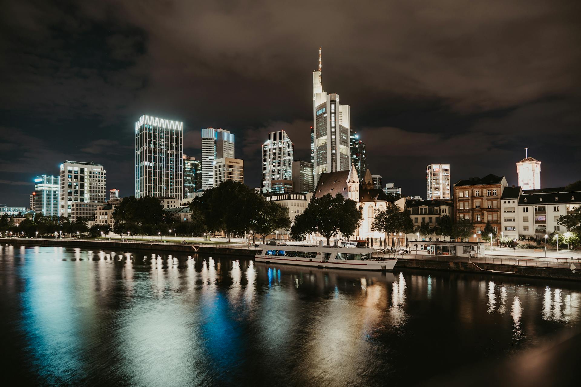 Ferry Moored at the Stop on the Main River in the Financial District of Frankfurt at Night