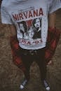 Person Wearing White and Red Nirvana Top