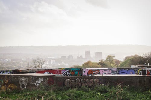 Graffiti on Walls overlooking City in Fog