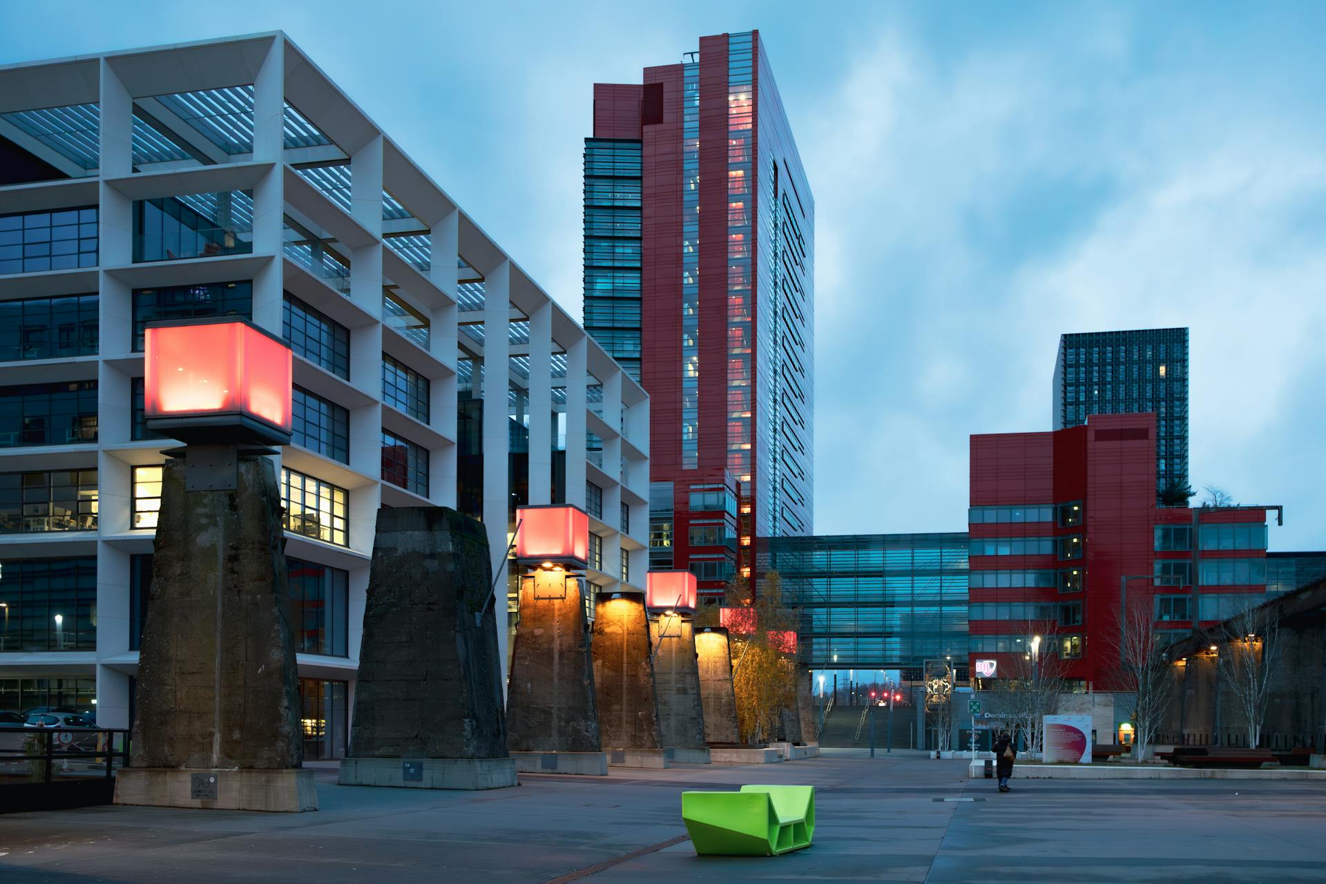 Dynamic cityscape featuring modern architecture in Luxembourg at twilight, highlighting unique urban design elements.