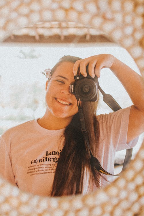 Woman Photographing her Self in Mirror