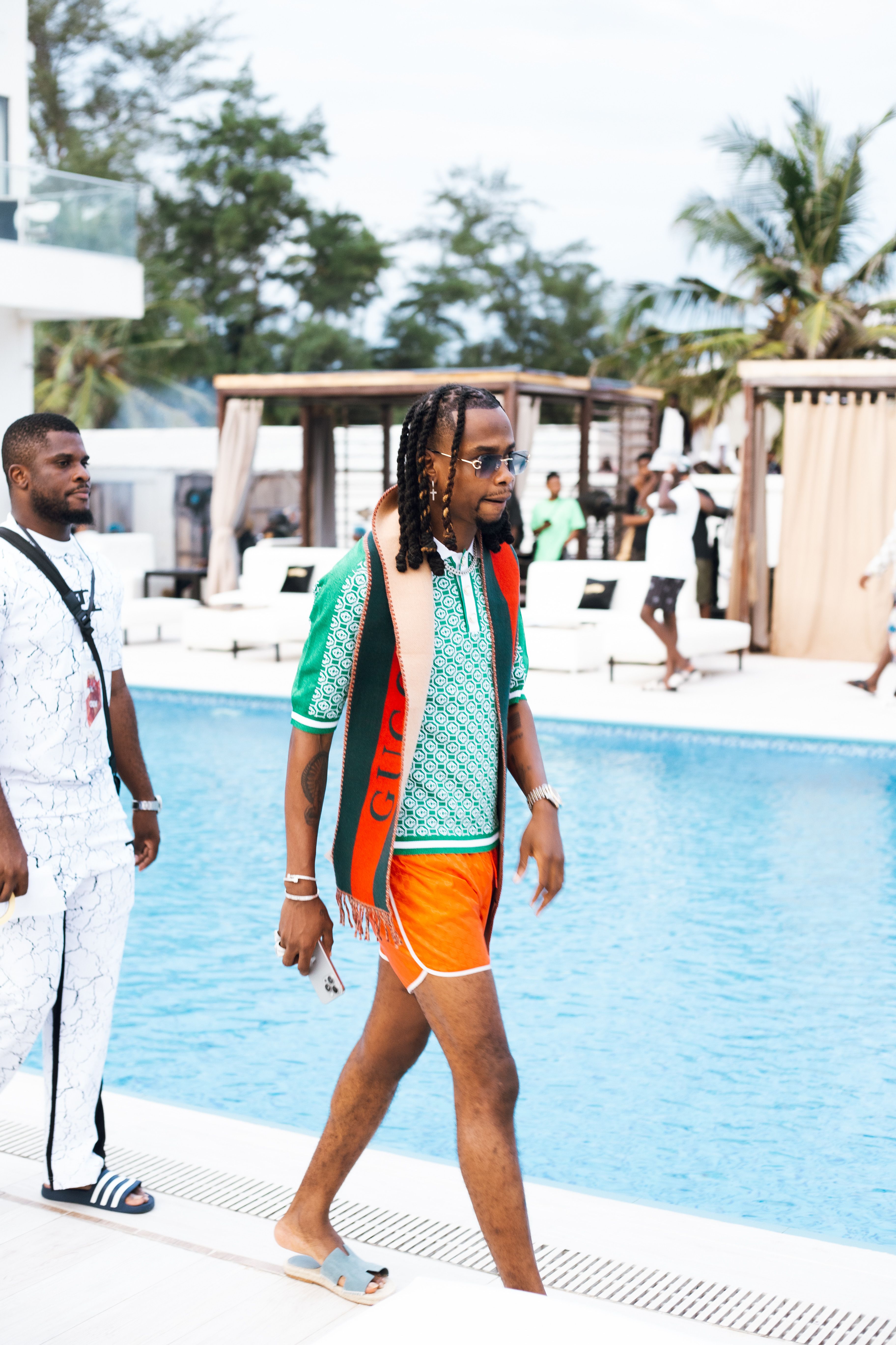 Man Walking by the Swimming Pool at a Party · Free Stock Photo