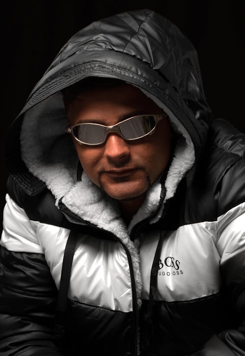 Man in Sunglasses and Jacket with Hood