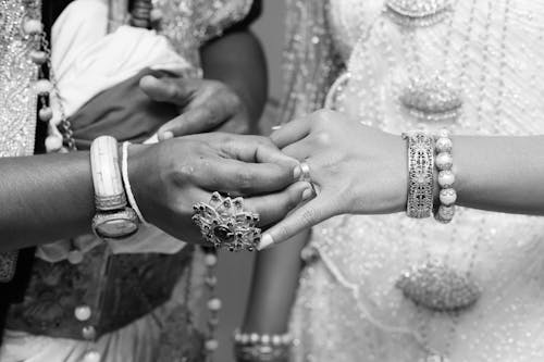 Free Close-up of Groom Putting the Ring on the Brides Finger Stock Photo