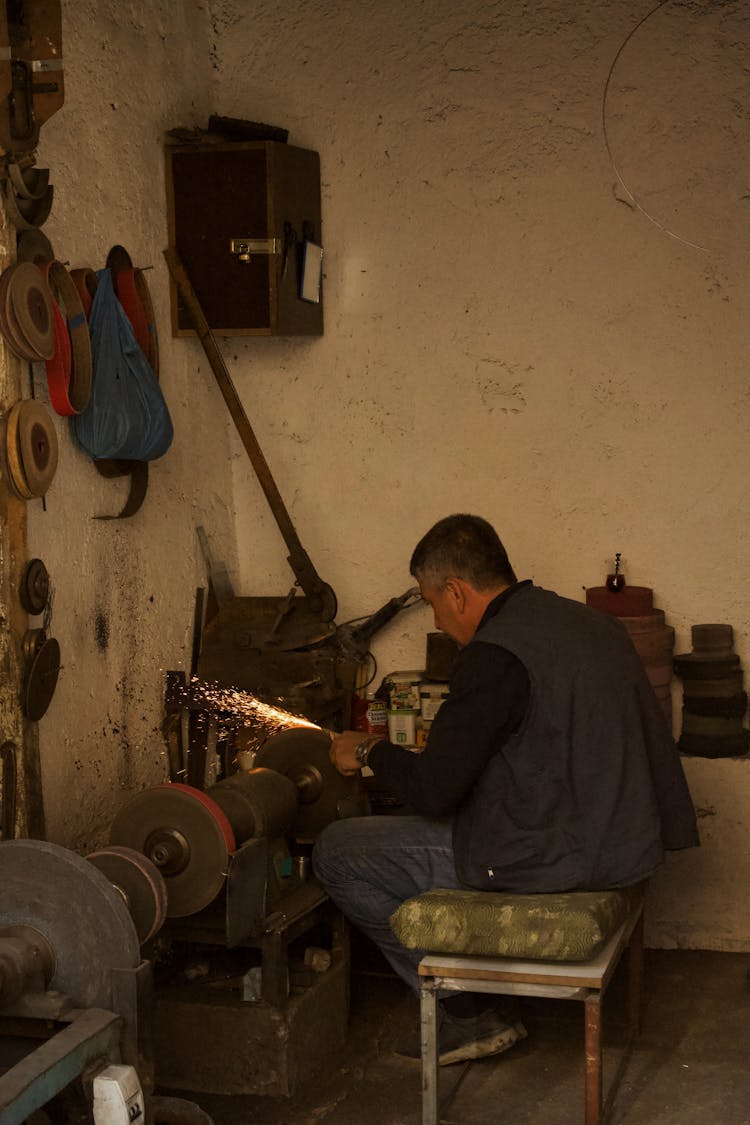 Smith Sitting And Working In Workshop