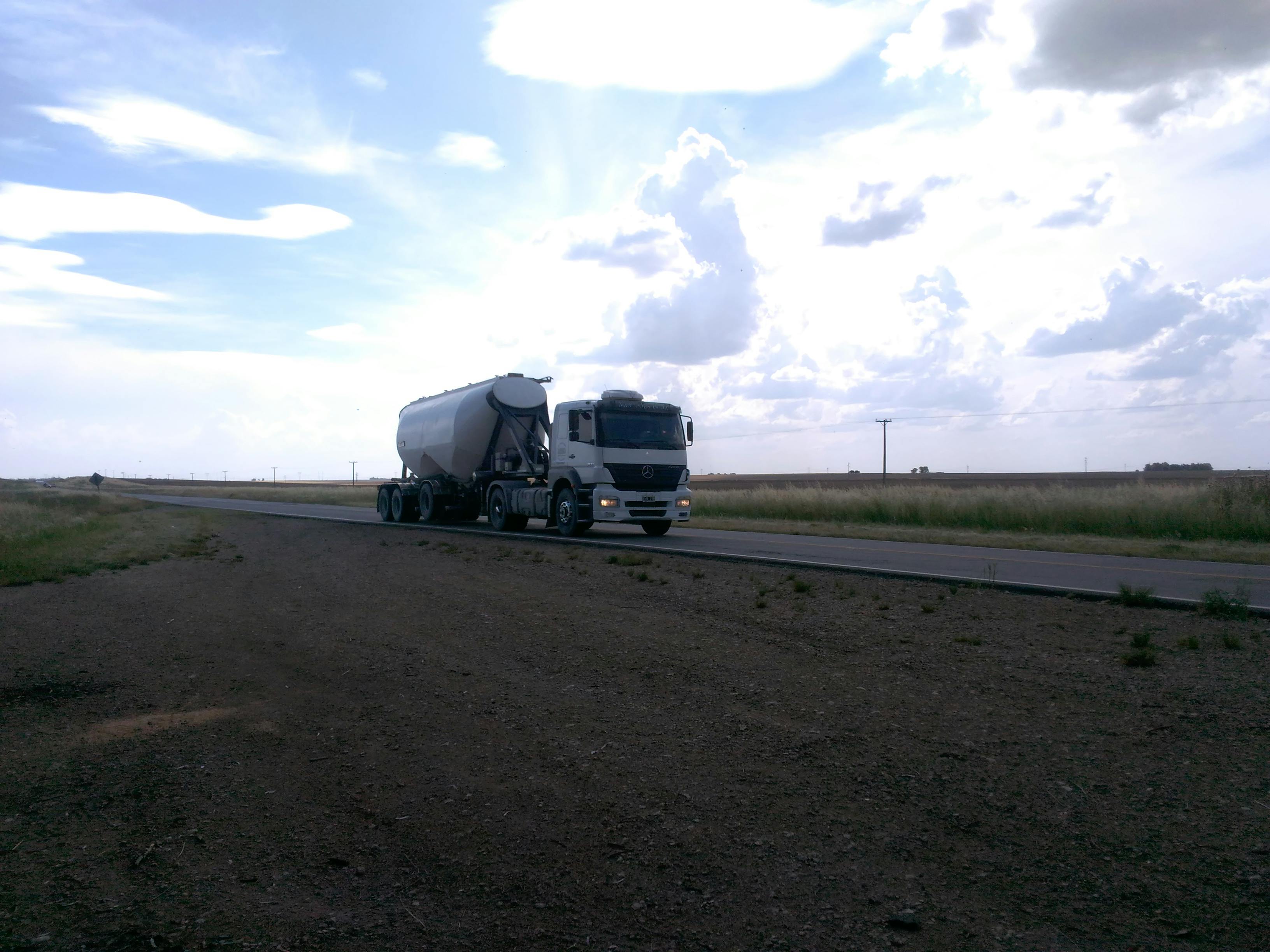 Person using a remote control to watch a television