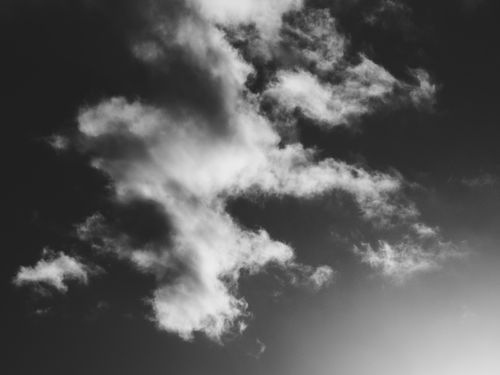 Free A striking black and white photograph showcasing dramatic cloud formations against a sky backdrop. Stock Photo