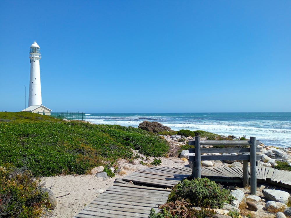 Slangkop Lighthouse and a Boardwalk on a Coast of the Sea 