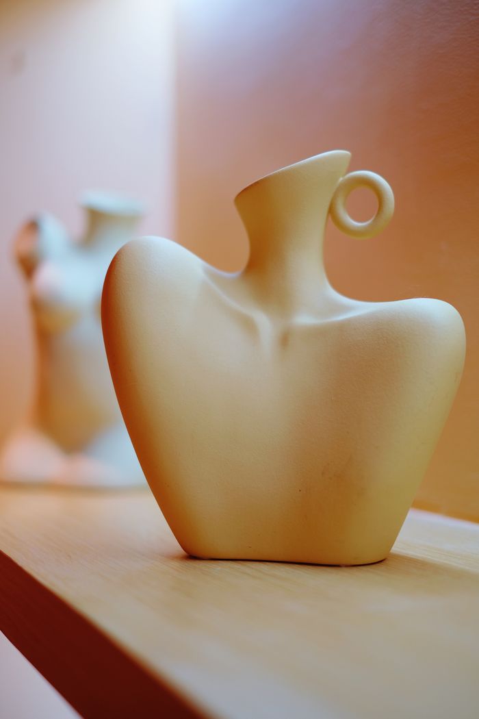 Ceramic vessel on a shelf, by 阳 濮 on Pexels
