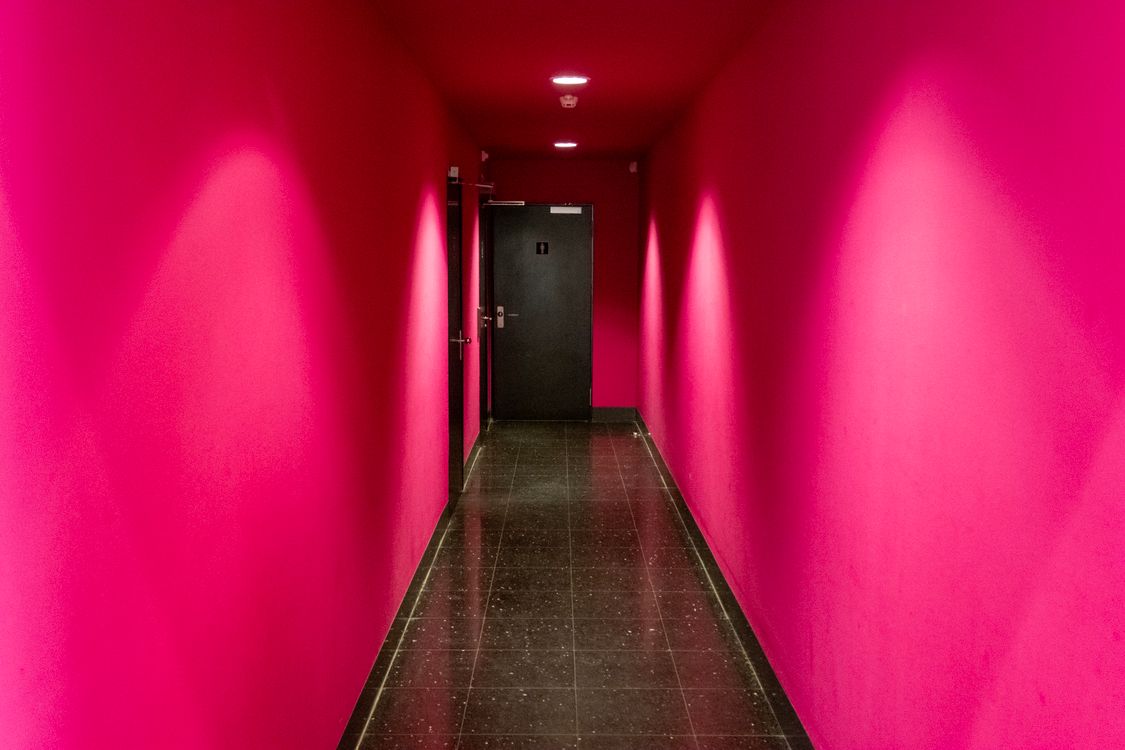 A Hallway with Bright Pink Walls · Free Stock Photo