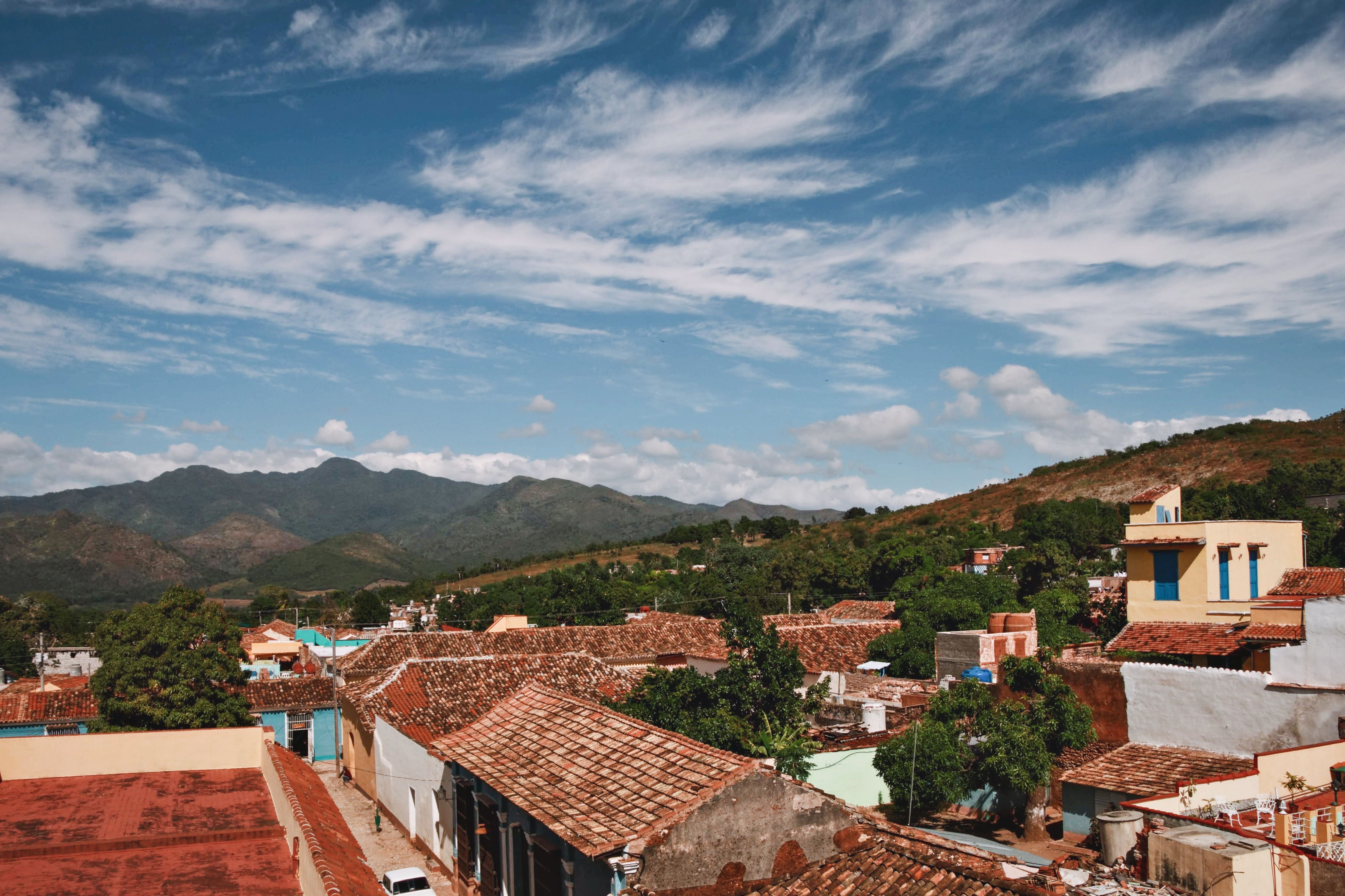 Adobe houses with tiled roofs on a grassy ridge in Yarula, La Paz, Honduras