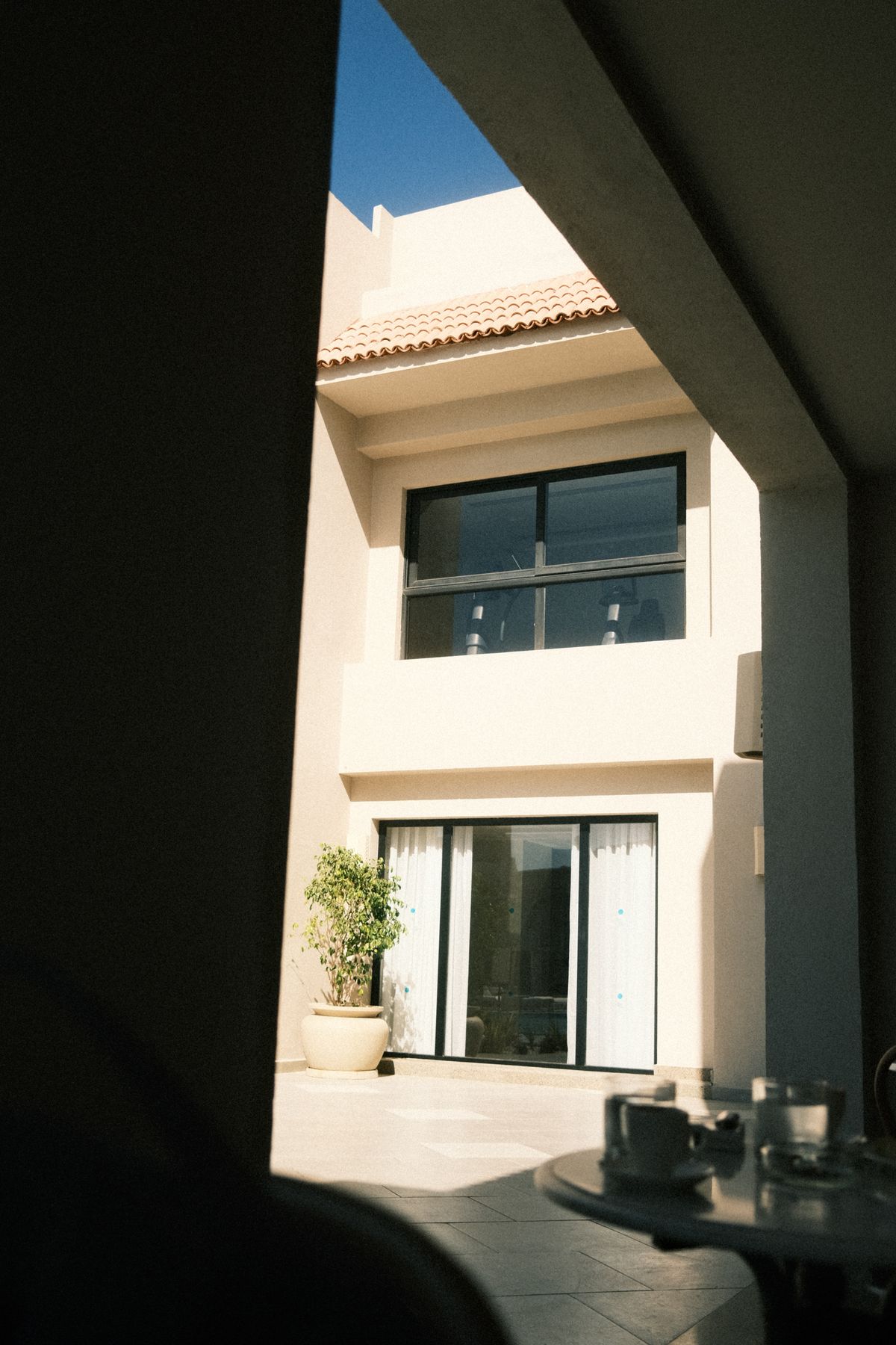 Home extension reference: modern house facade with a covered patio (stock placeholder)