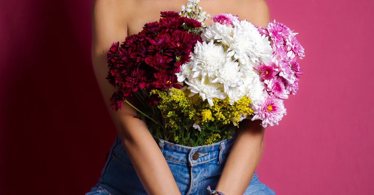 Shirtless Woman Covering Chest with Flower Bouquet · Free Stock Photo
