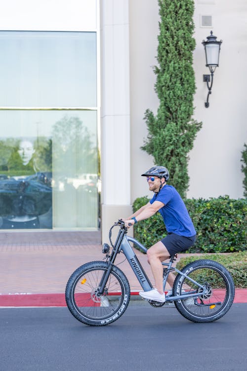 Man Riding a Bike on a Street 