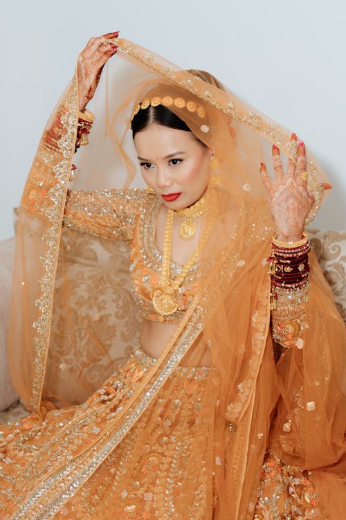 Bride Sitting in Traditional Clothing
