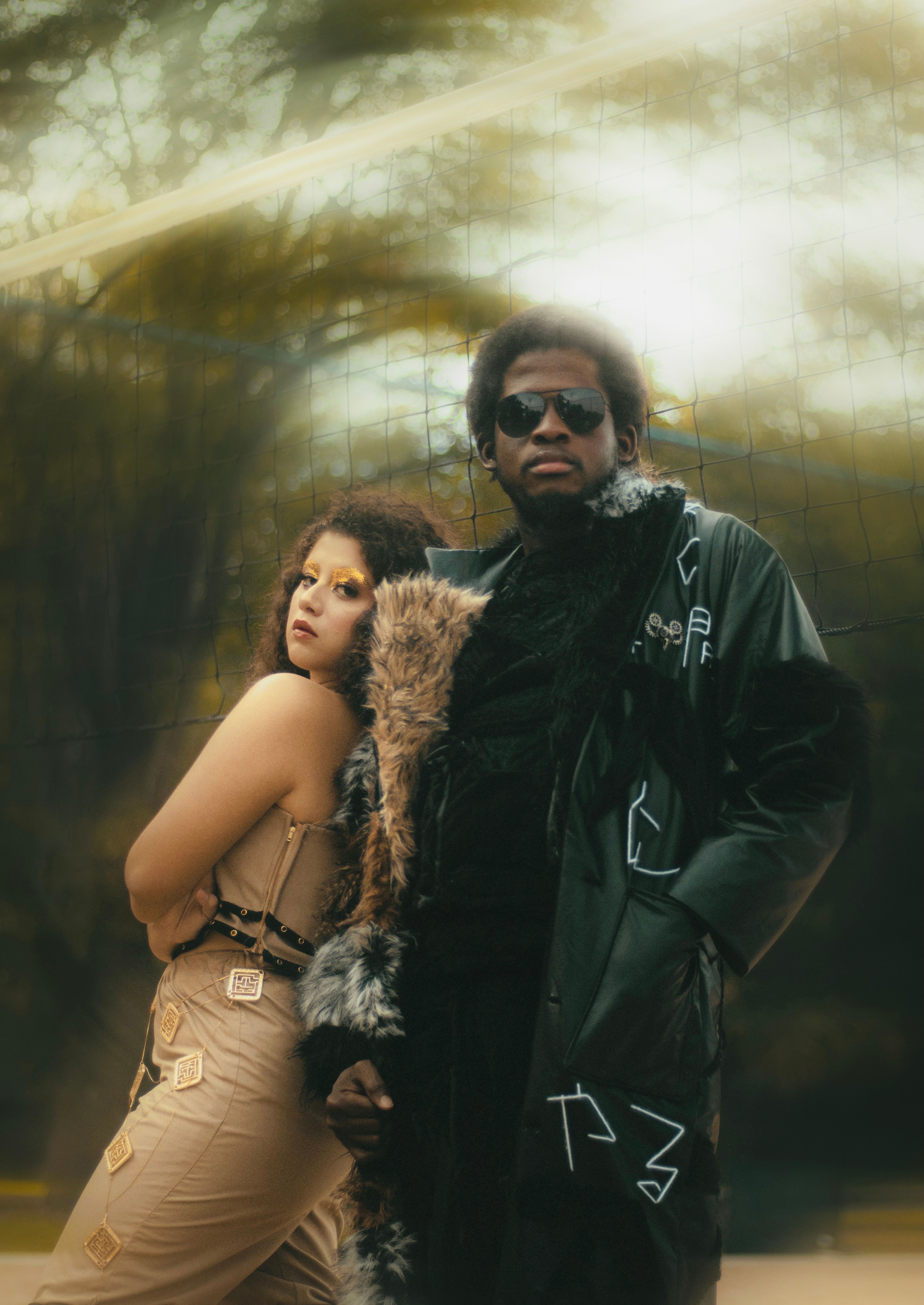 Man in Leather Coat Posing by Brunette Woman · Free Stock Photo