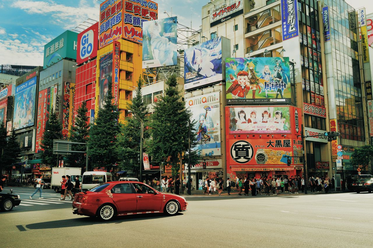 street view of akihabara tokyo with colorful billboards and bustling a