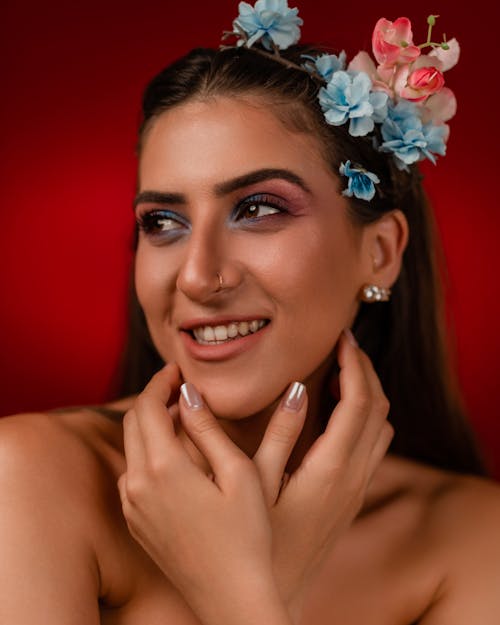 Portrait of Woman Wearing Makeup and Flowers in Hair