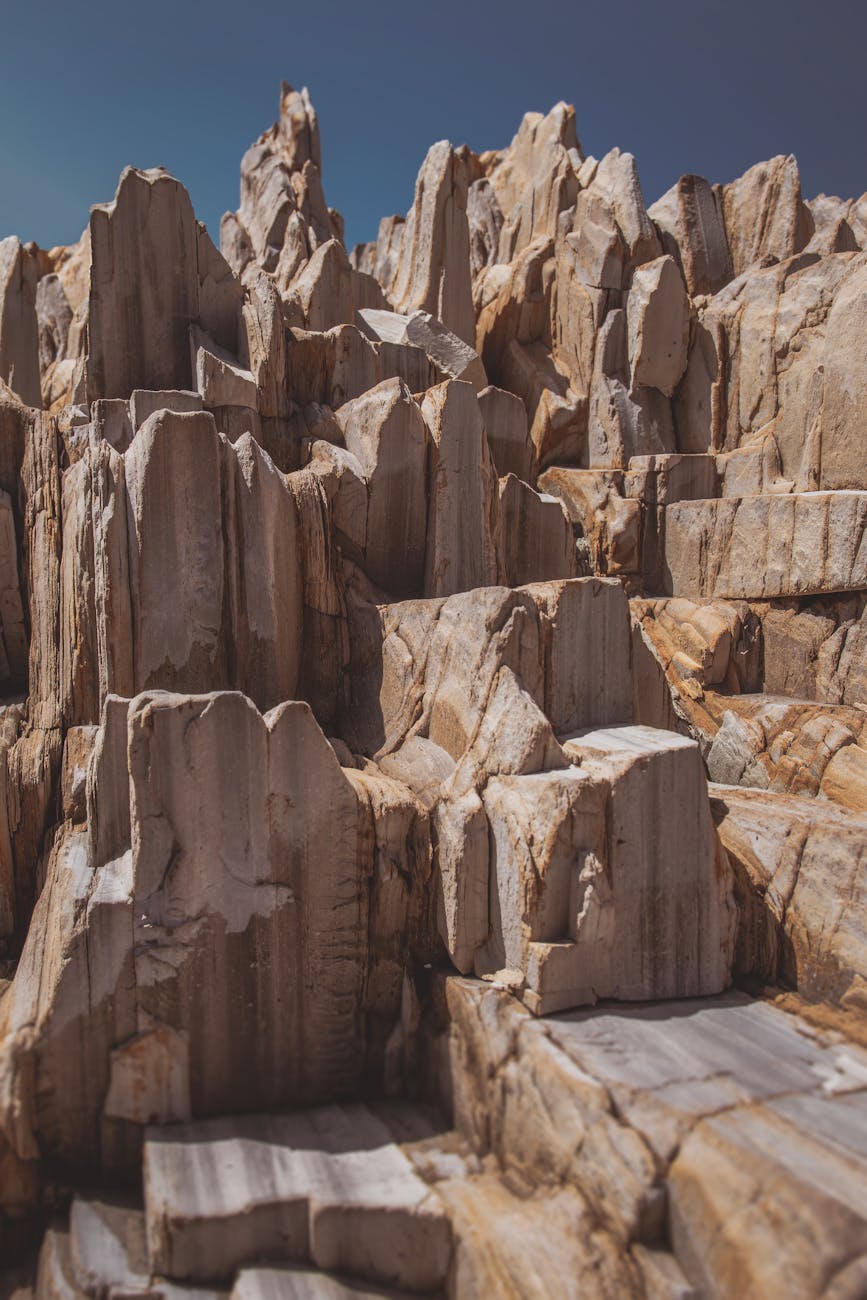 Captivating sandstone formations under clear sky, highlighting geological beauty.