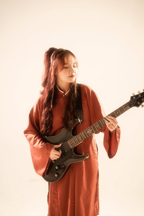 Young Woman Playing Guitar