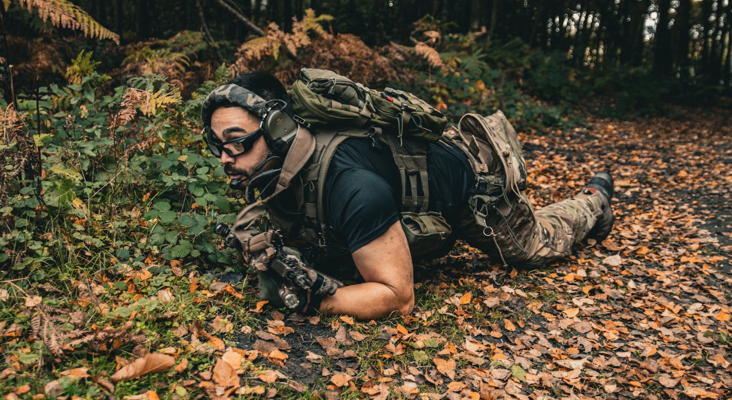 Tactical bushcraft gear in forest environment