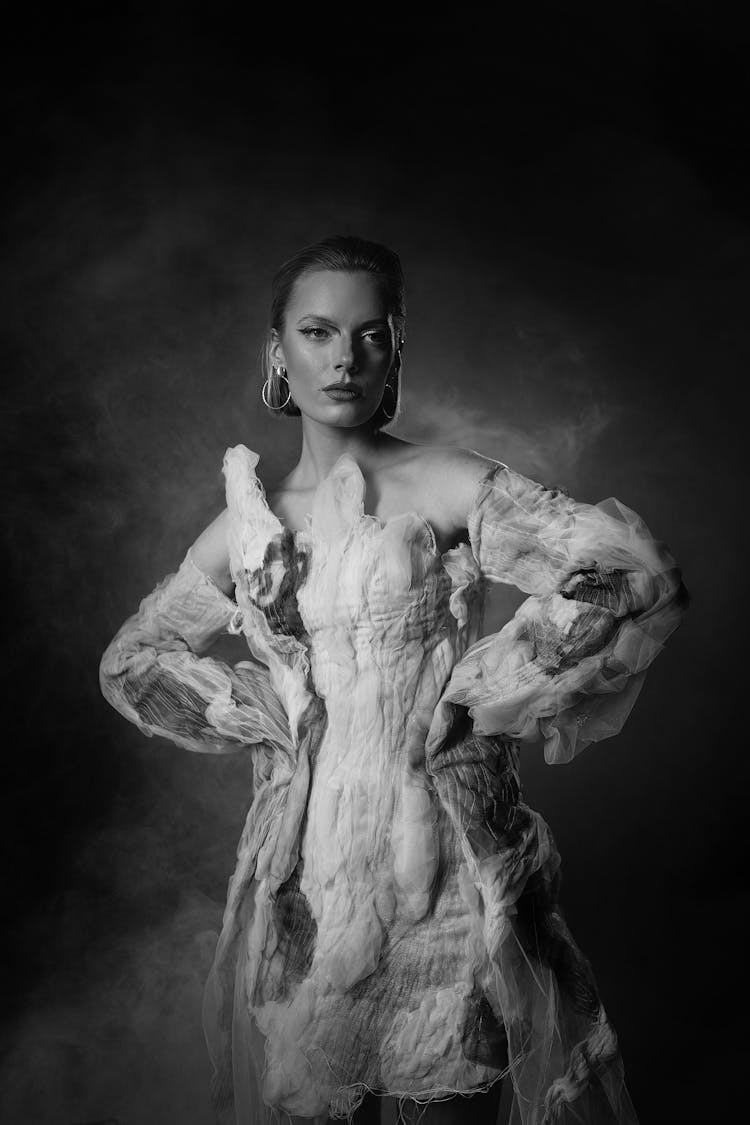 Woman Standing With Hands On Hips In Black And White