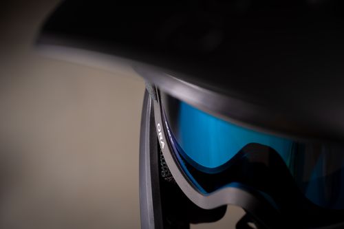 Free Detailed view of a cycling helmet featuring vibrant blue goggles for enhanced protection. Stock Photo