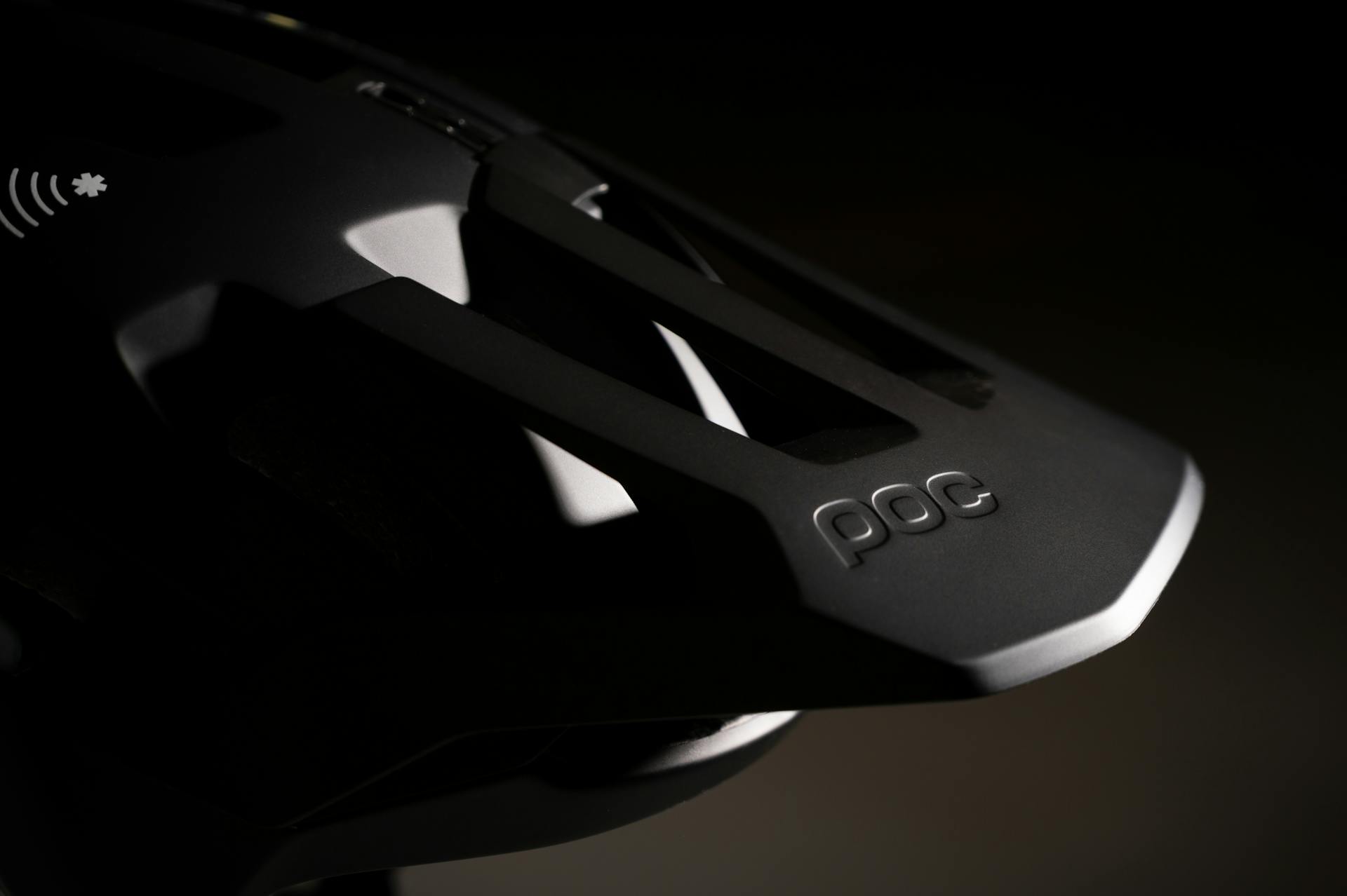 Detailed shot of a POC cycling helmet showcasing design and branding.