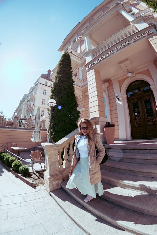 Woman leaving the hotel in Karlovy Vary