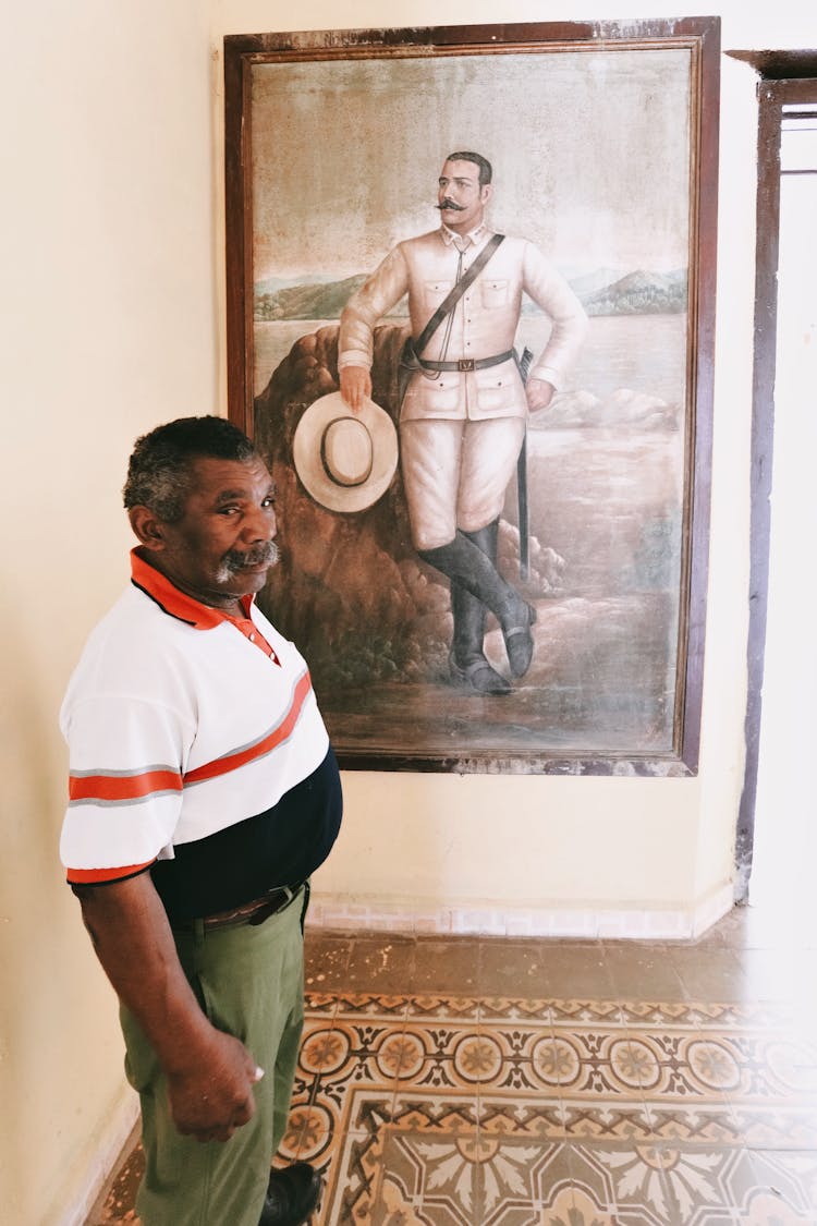 Man Standing In Front Of A Painting 