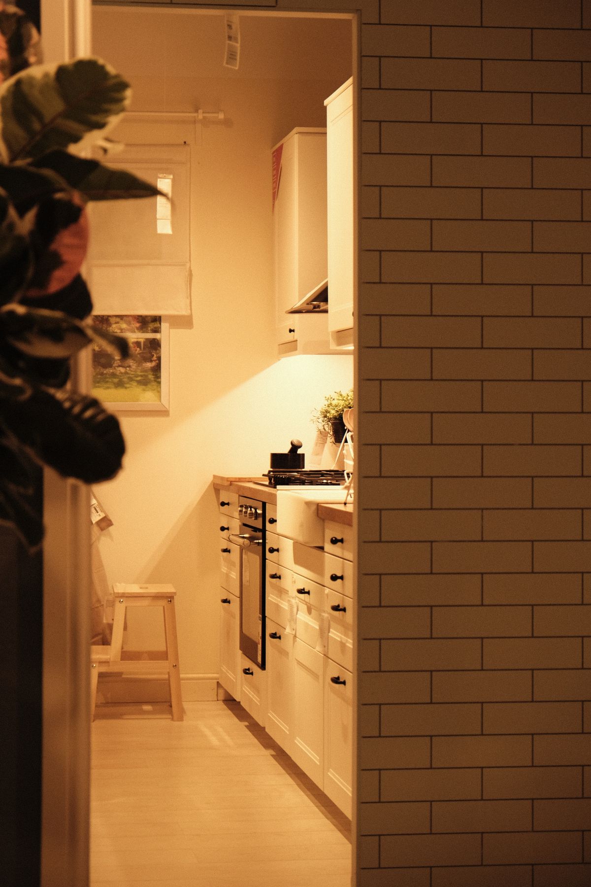 Small functional kitchen with white cabinets and modern design