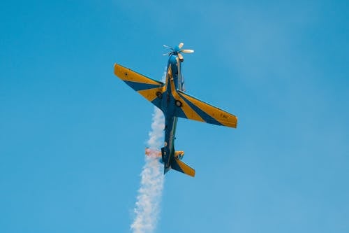 Plane Flying in Blue Sky 