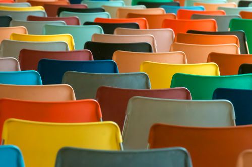 Free A colorful array of chairs in a classroom setting. Perfect for educational or design concepts. Stock Photo