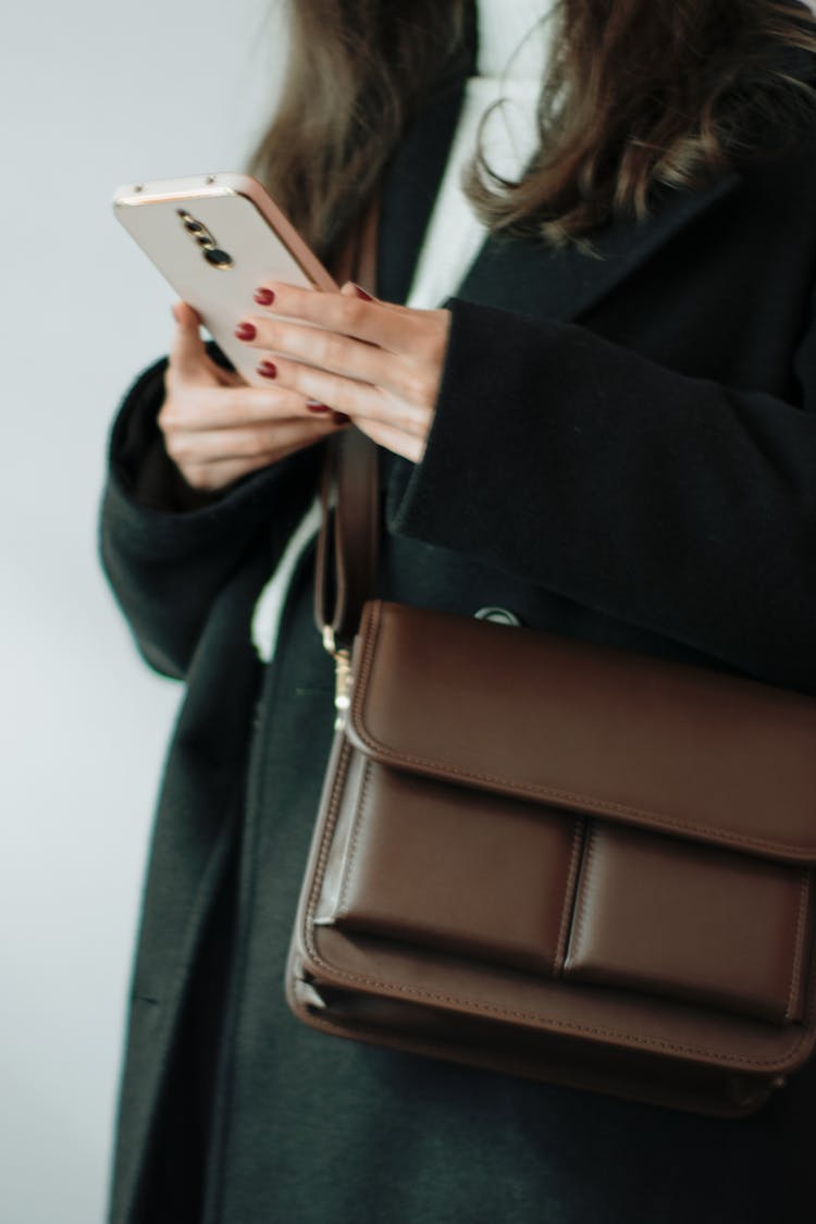 Woman Wearing Brown Leather Bag And Coat