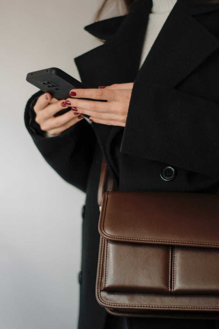 Woman Wearing Brown Leather Bag And Coat