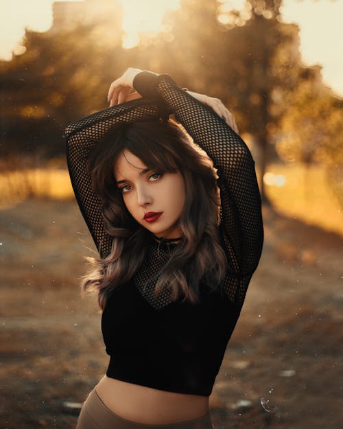 Young Beautiful Woman in a Black Crop Top 