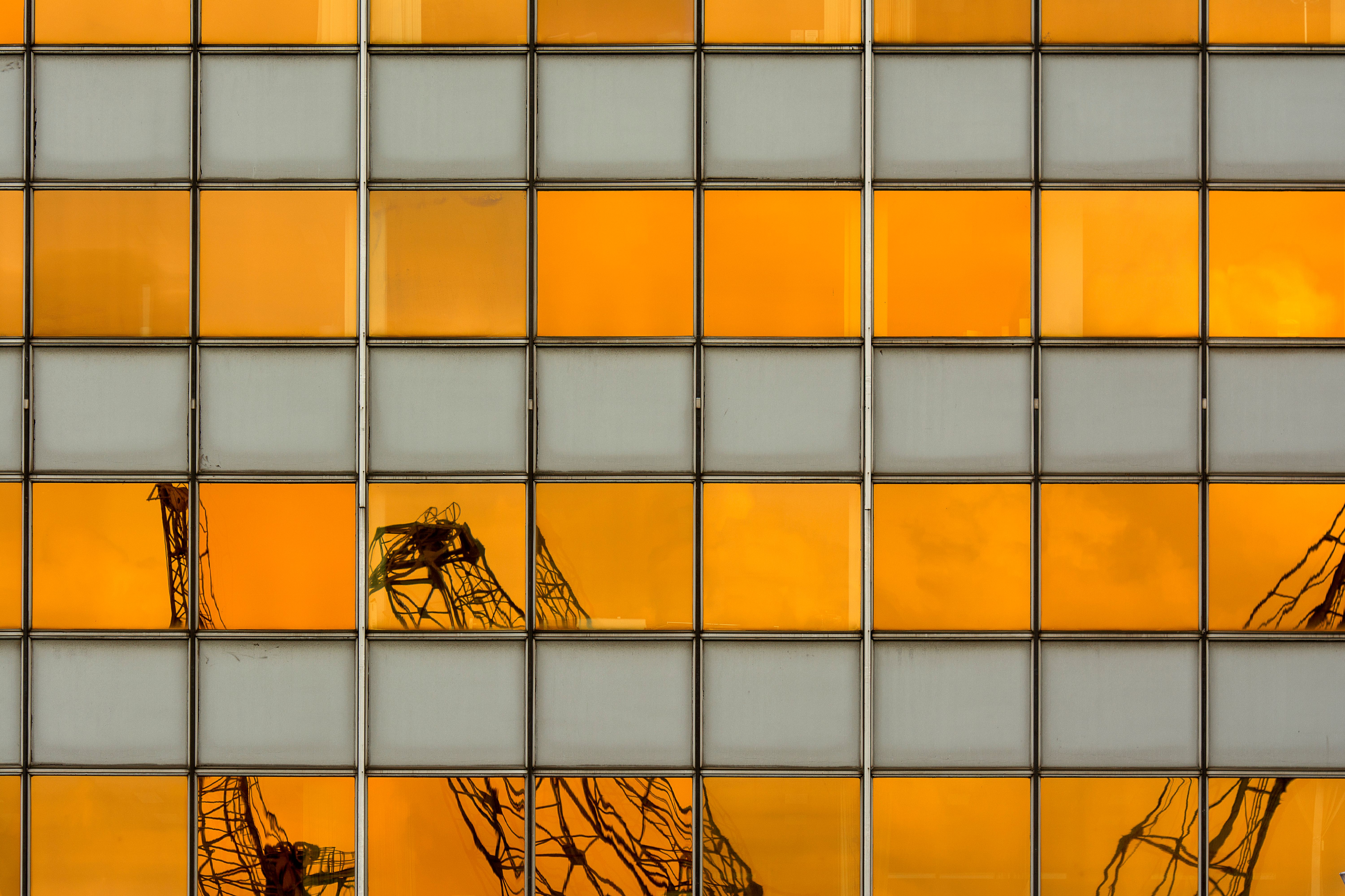 Construction cranes over a Toronto condo project as new supply is delivered
