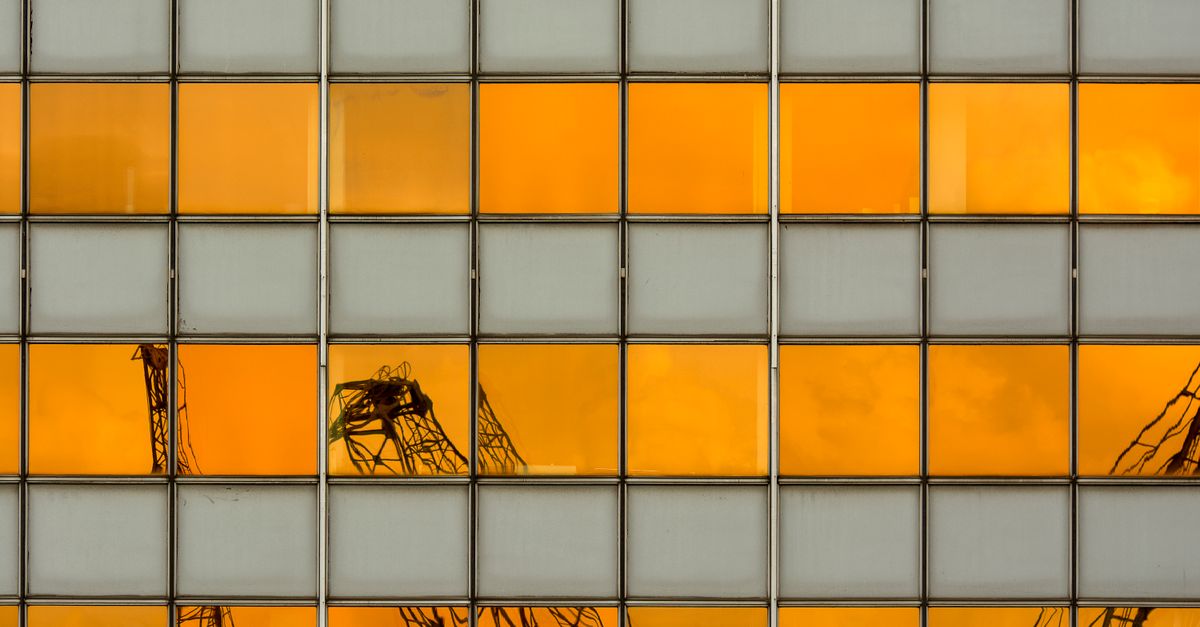 Construction cranes over a Toronto condo project as new supply is delivered