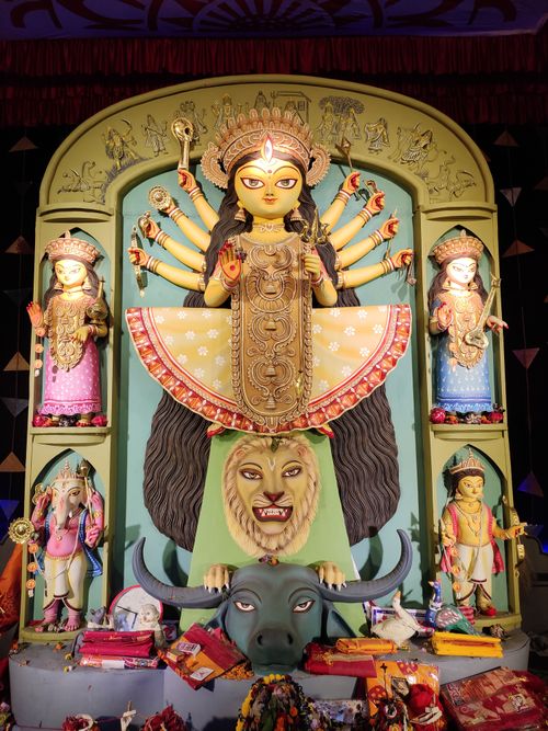Free Colorful Durga Puja statue captured in a temple in Kolkata, showcasing traditional Hindu art. Stock Photo