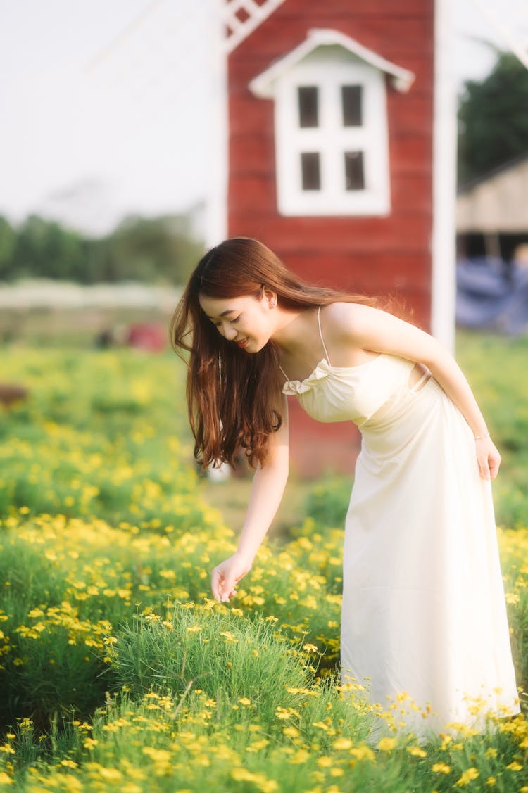 Woman Wearing White Dress On A Field