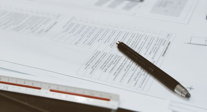 Planning pages and a pen on a desk