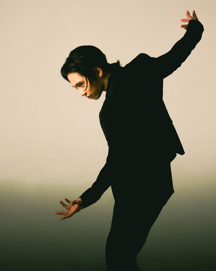 Man Posing In Suit In Studio 