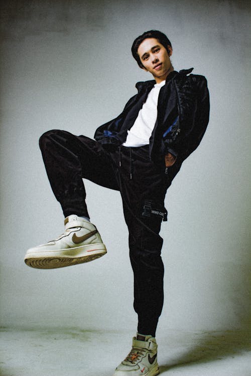 Man Wearing Black Outfit and White Sneakers