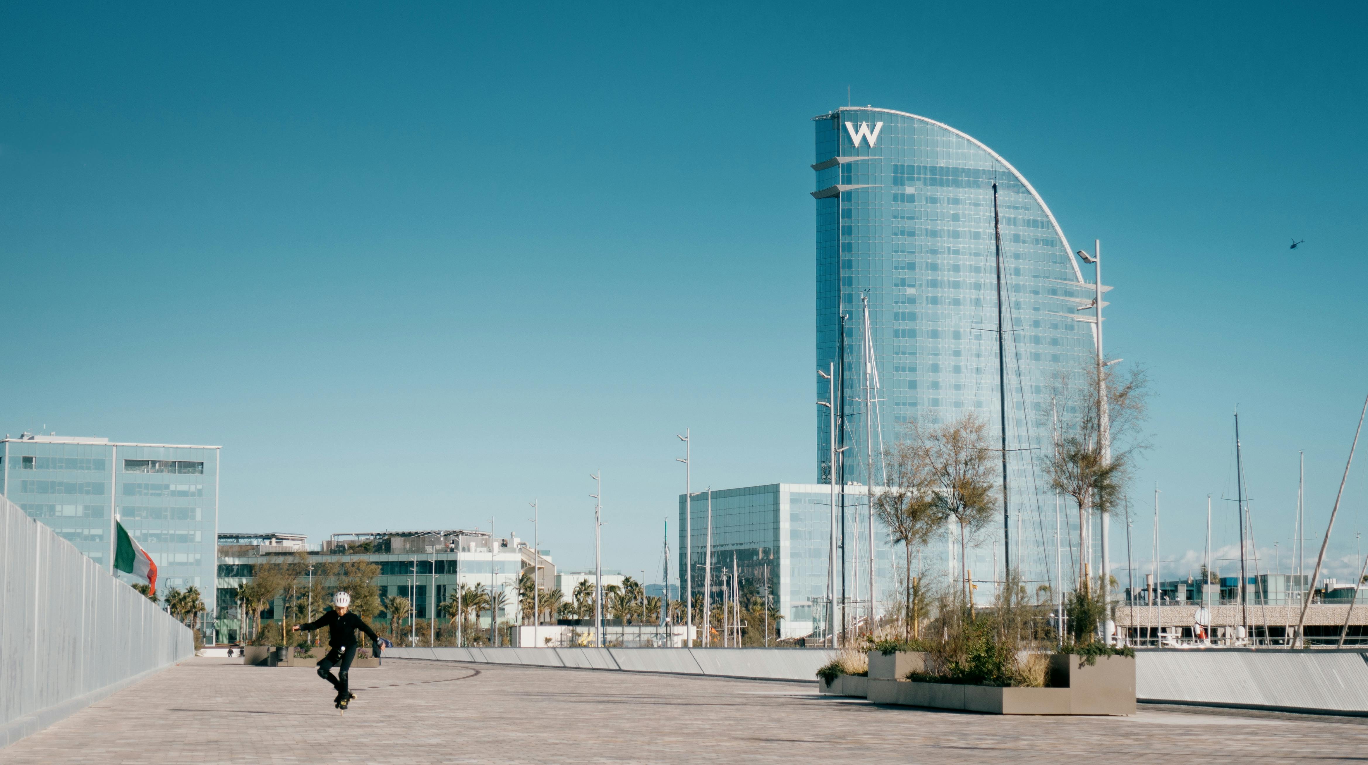 person skating in front of w hotel in barcelona spain